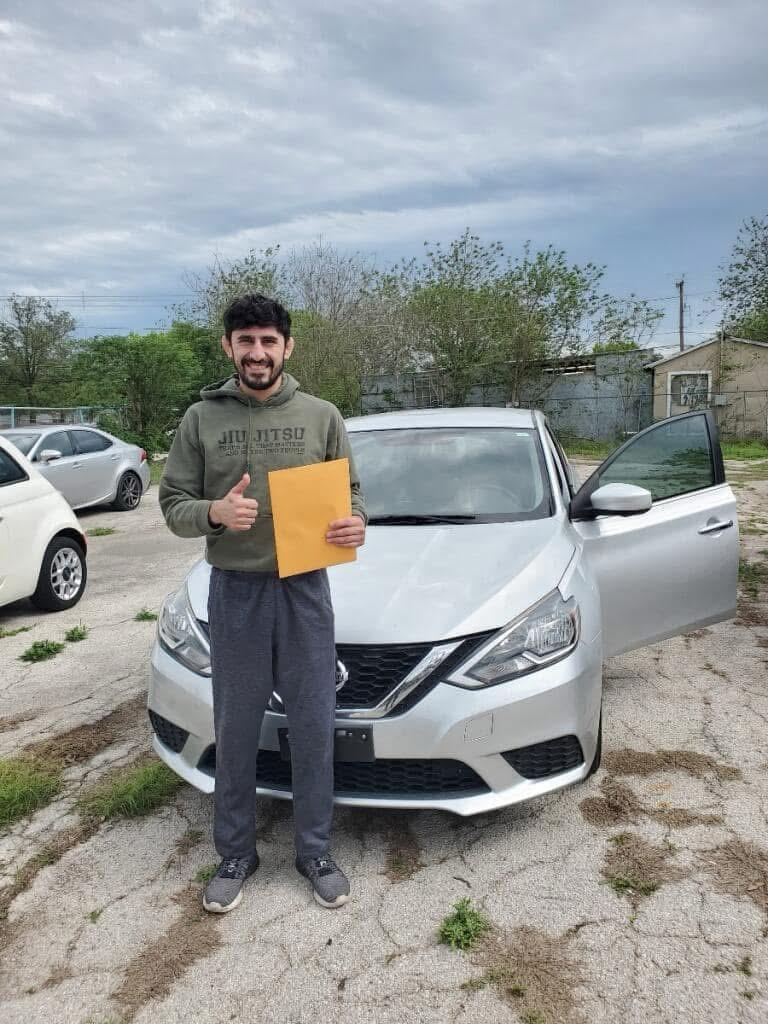 A happy Towns Auto customer with their newly purchased car